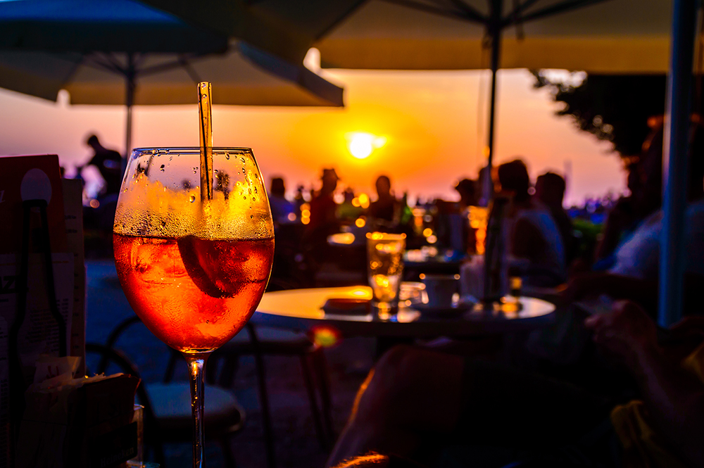 A,Glass,Of,Cold,Orange,Cocktail,At,The,Sunset,On